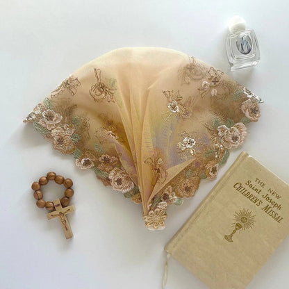 Child beige lace chapel veil featuring delicate embroidered floral pattern.