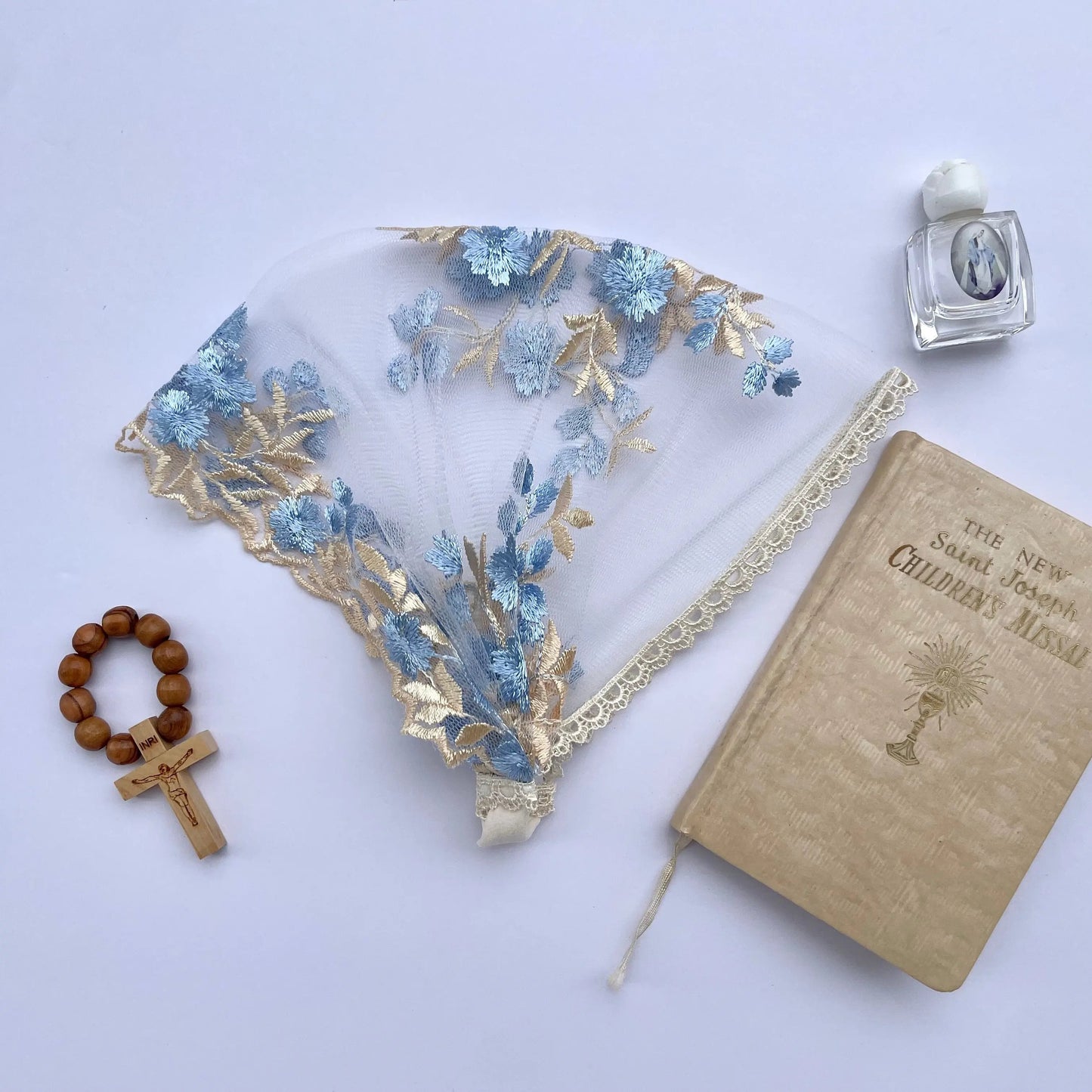 Newborn blue gold embroidered lace veil for a traditional Catholic mass.