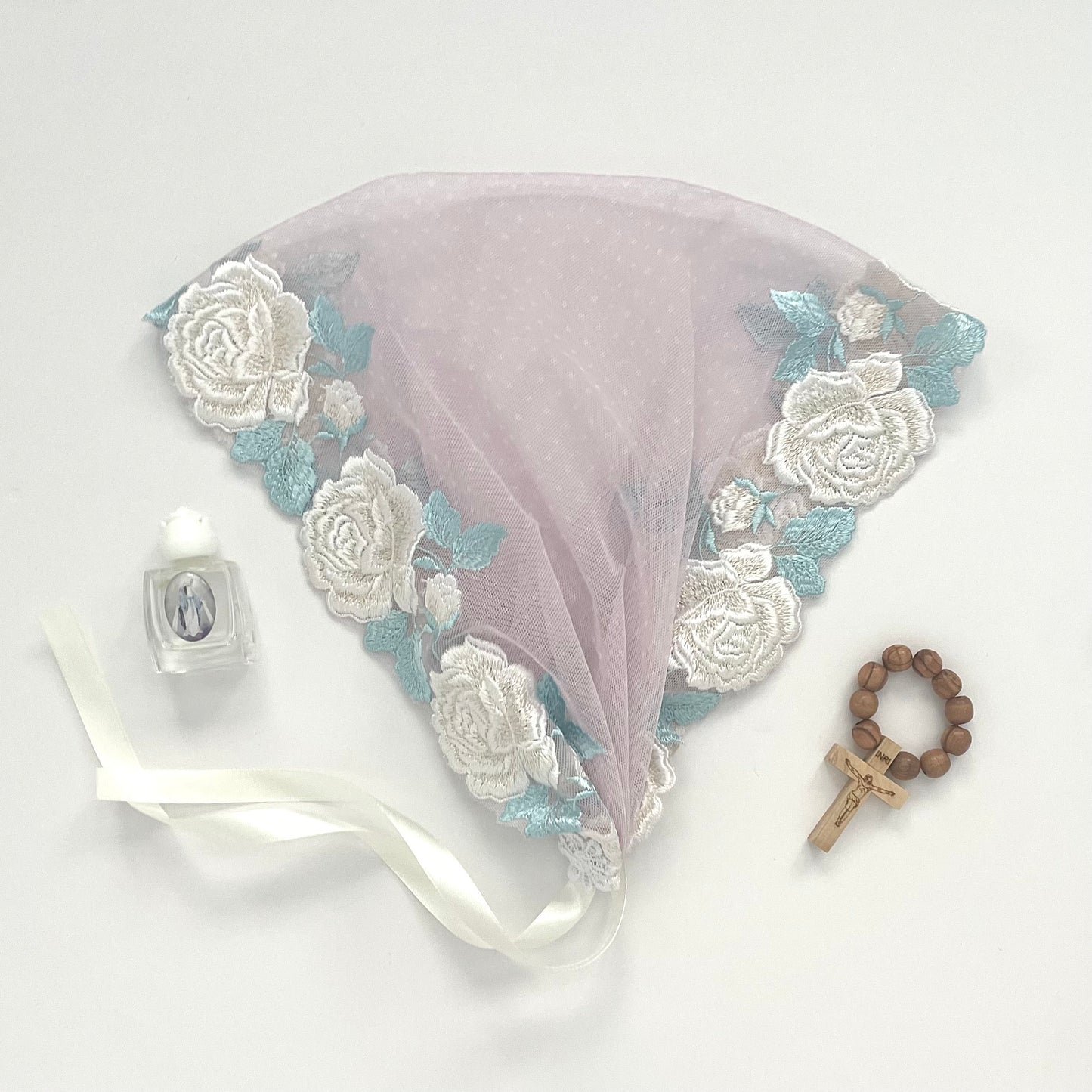 Pale pink lace chapel veil with white rose. The small girls veil mantilla is perfect for Traditional Catholic Christian Mass