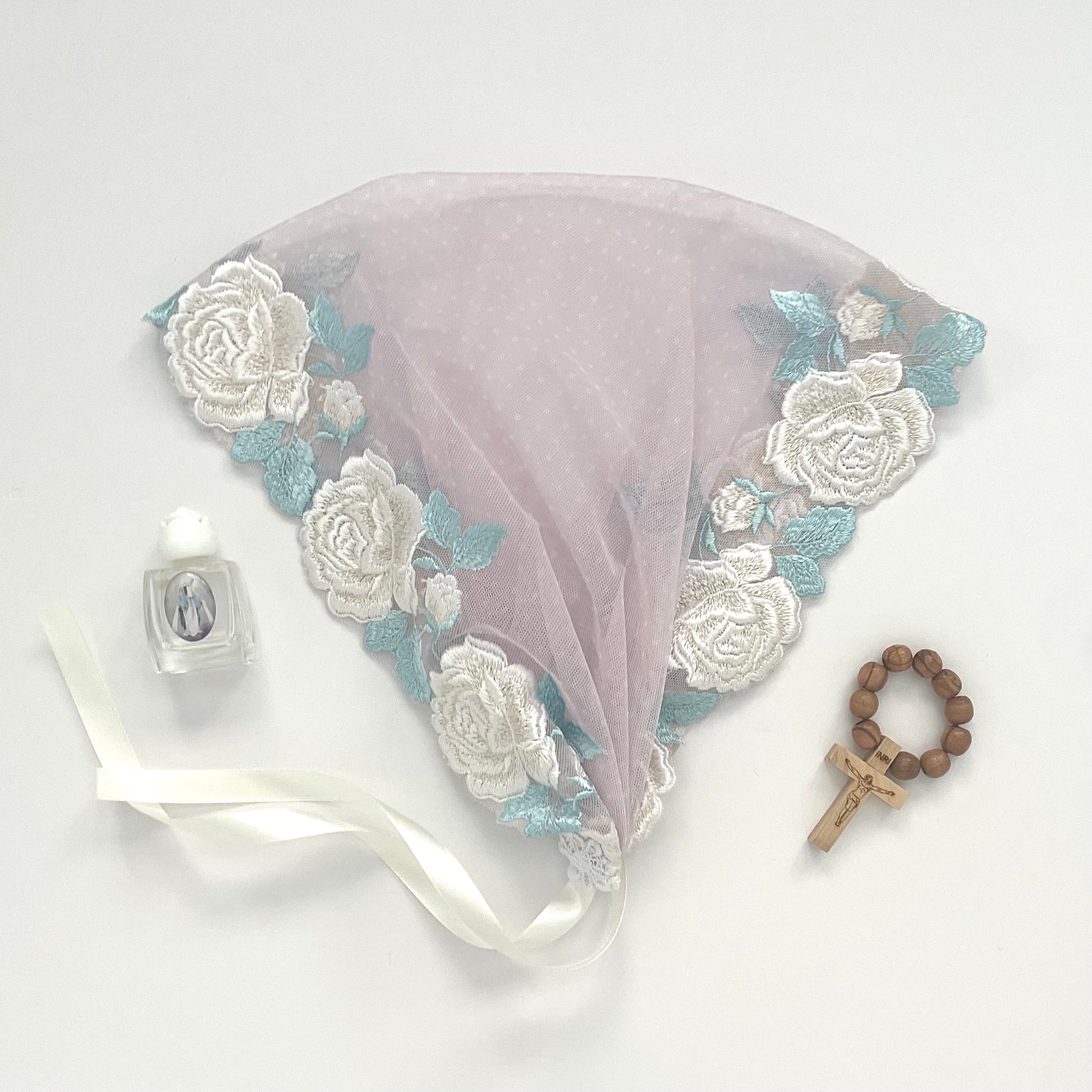 Pale pink lace chapel veil with white rose. The small girls veil mantilla is perfect for Traditional Catholic Christian Mass