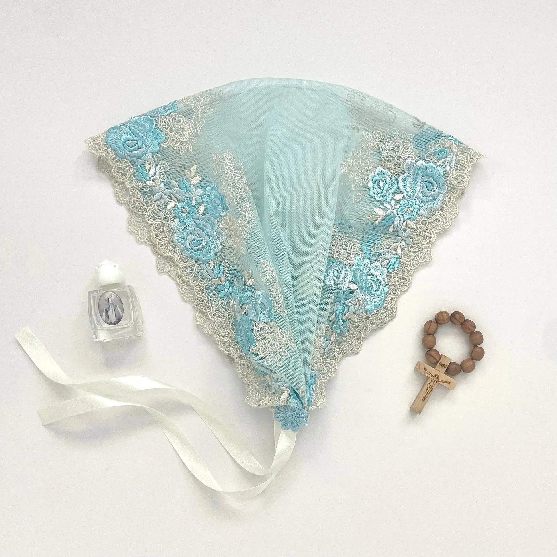 Light blue lace chapel veil with rose embroidery. The small girl mantilla is perfect for Traditional Catholic Christian Mass