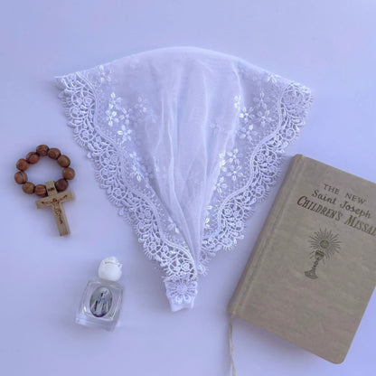Delicate white lace baby veil for a Catholic baptism or traditional mass. 