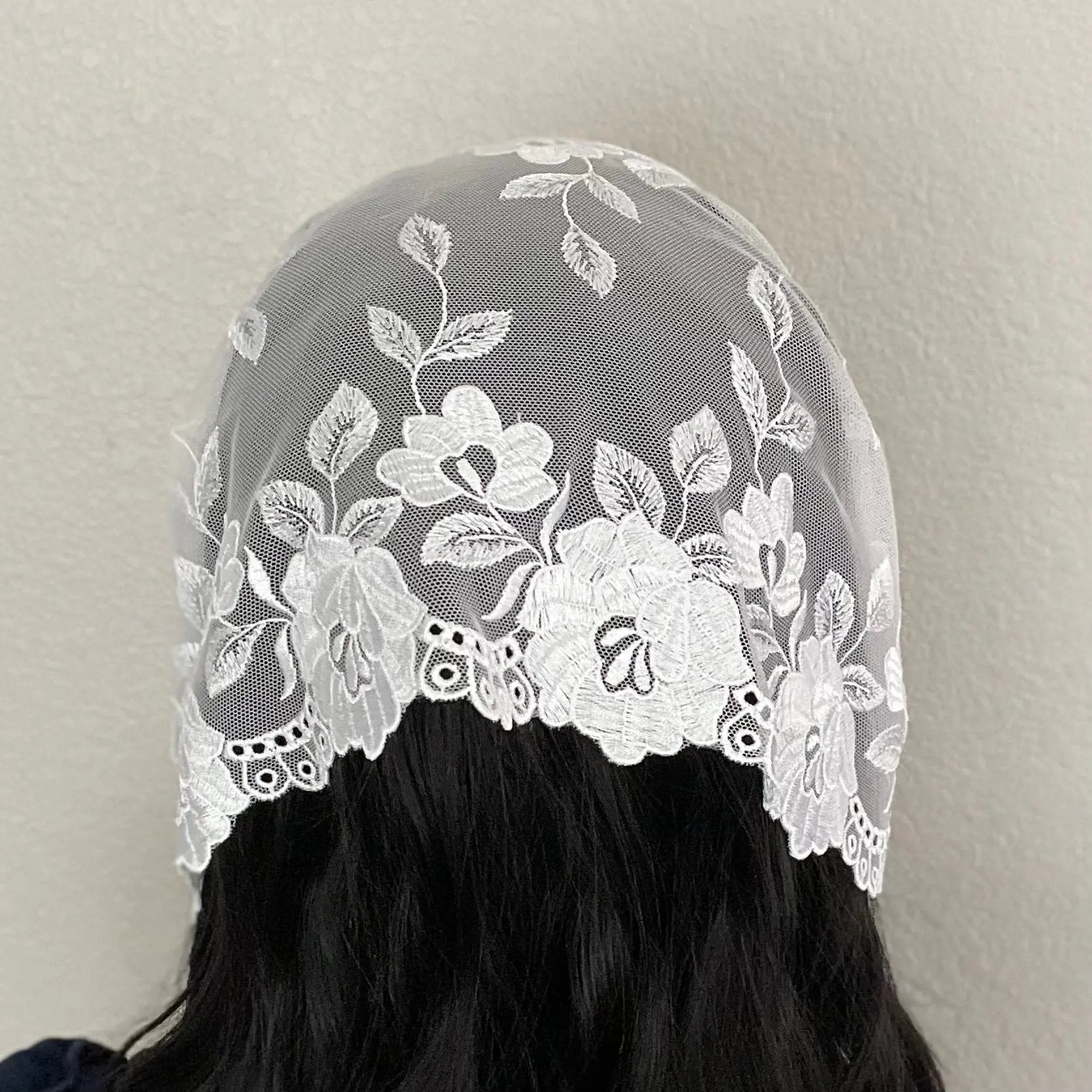 Back view of a small white colored headwrap Catholic Mass chapel veil.
