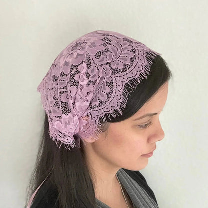 Girl wearing a light purple Christian prayer veil kerchief.