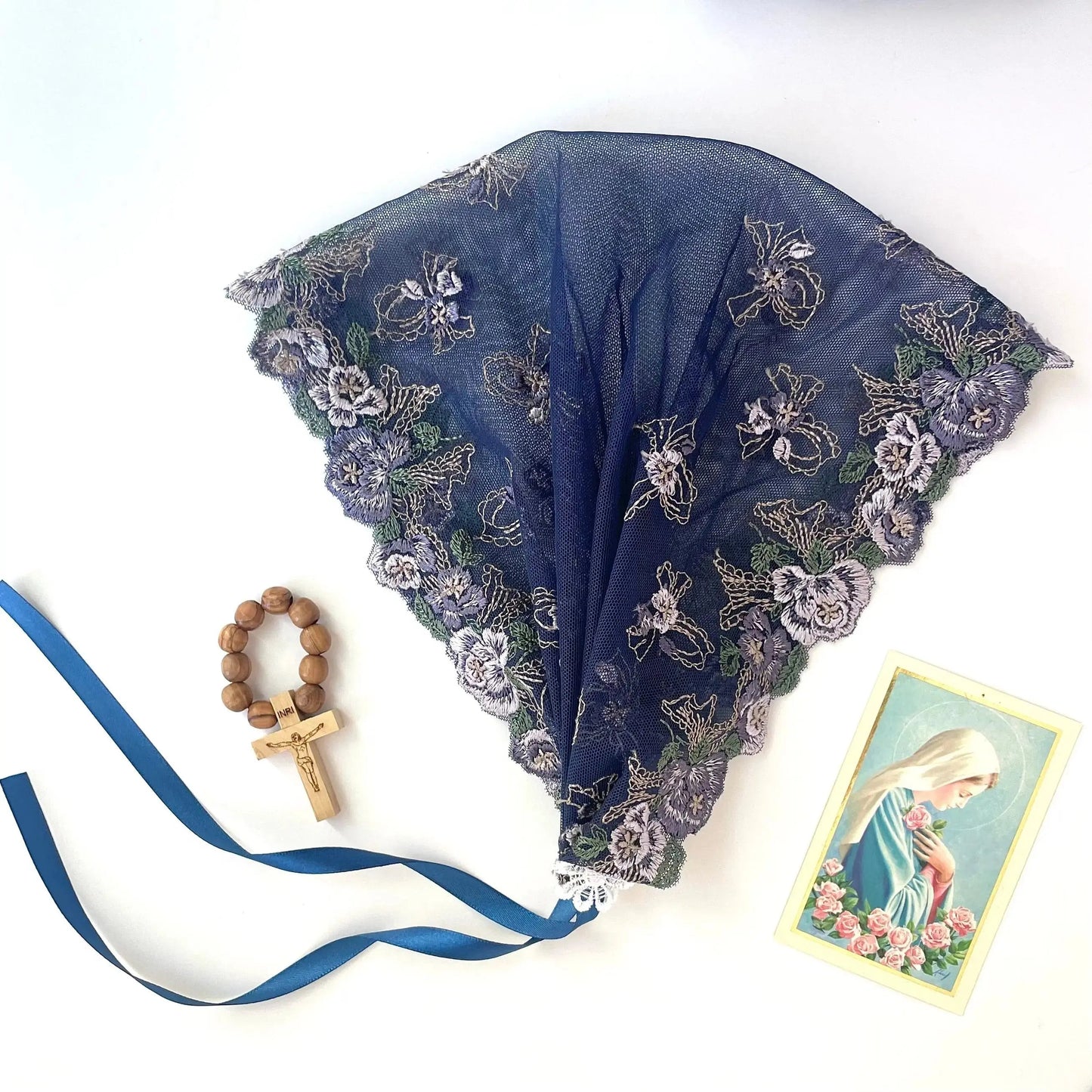 Dark blue embroidered ivory lace chapel veil headband, a traditional headwrap for a girl's Catholic mass.