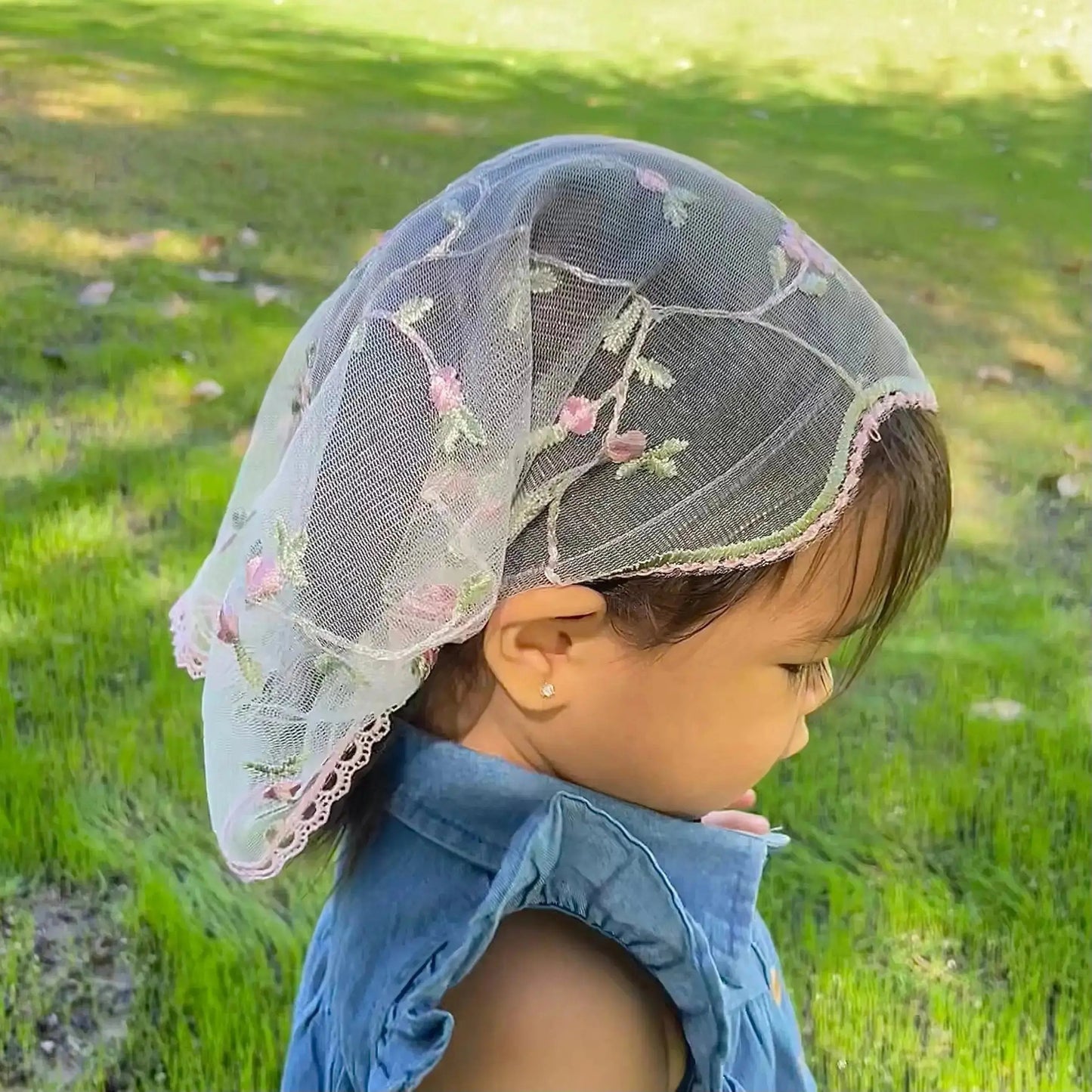 Pink embroidered lace baby headband veil for Catholic prayer services and devotions.