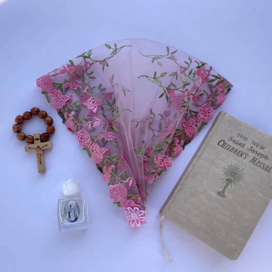 Infant pink lace chapel veil with embroidered roses used for traditional Catholic mass. 