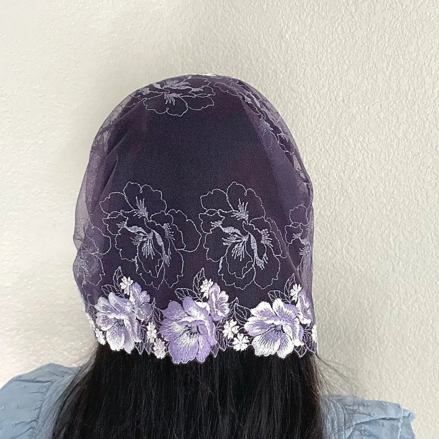 Woman wearing a purple lace chapel veil with rose embroidery. Perfect for penitential liturgical seasons of lent or advent