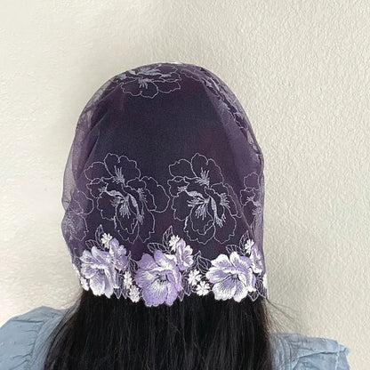 Woman wearing a purple lace chapel veil with rose embroidery. Perfect for penitential liturgical seasons of lent or advent