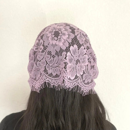 Back view of girl wearing a traditional purple eyelash lace Catholic chapel veil for the season of Lent.