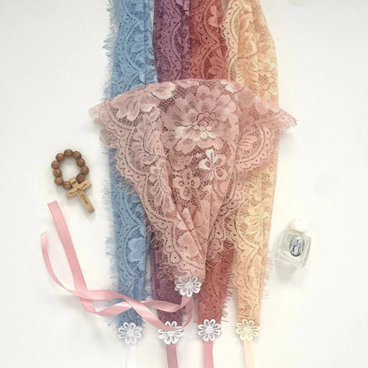 Small lace chapel veils with ribbon ties in a variety of colors with daisy detailing.