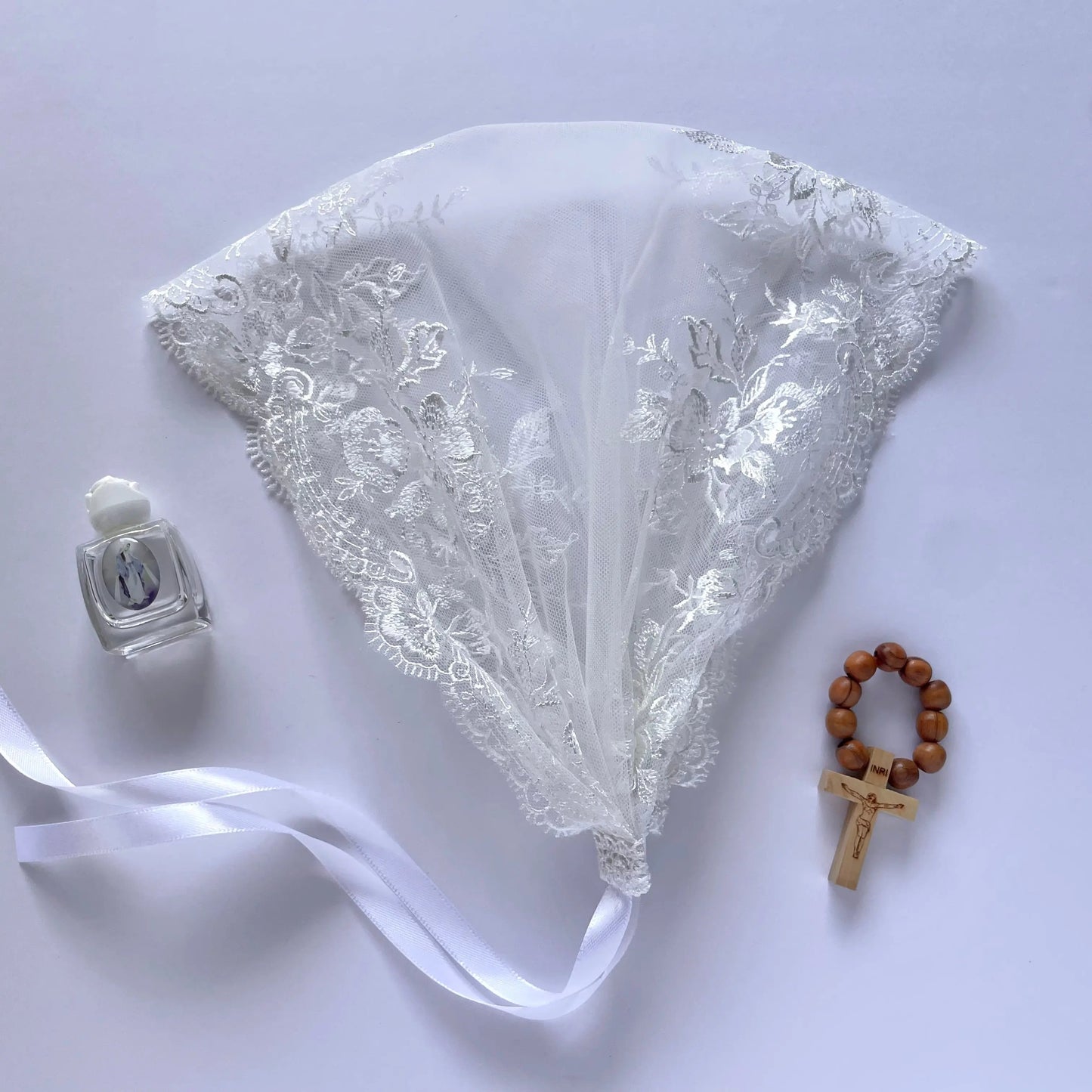 One size white embroidered lace headwrap for a Catholic Christian Holy Communion.
