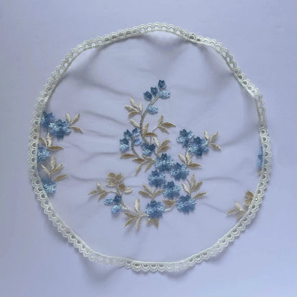 Floral embroidered blue gold lace circular veil for girls at traditional Catholic mass or a prayer service.