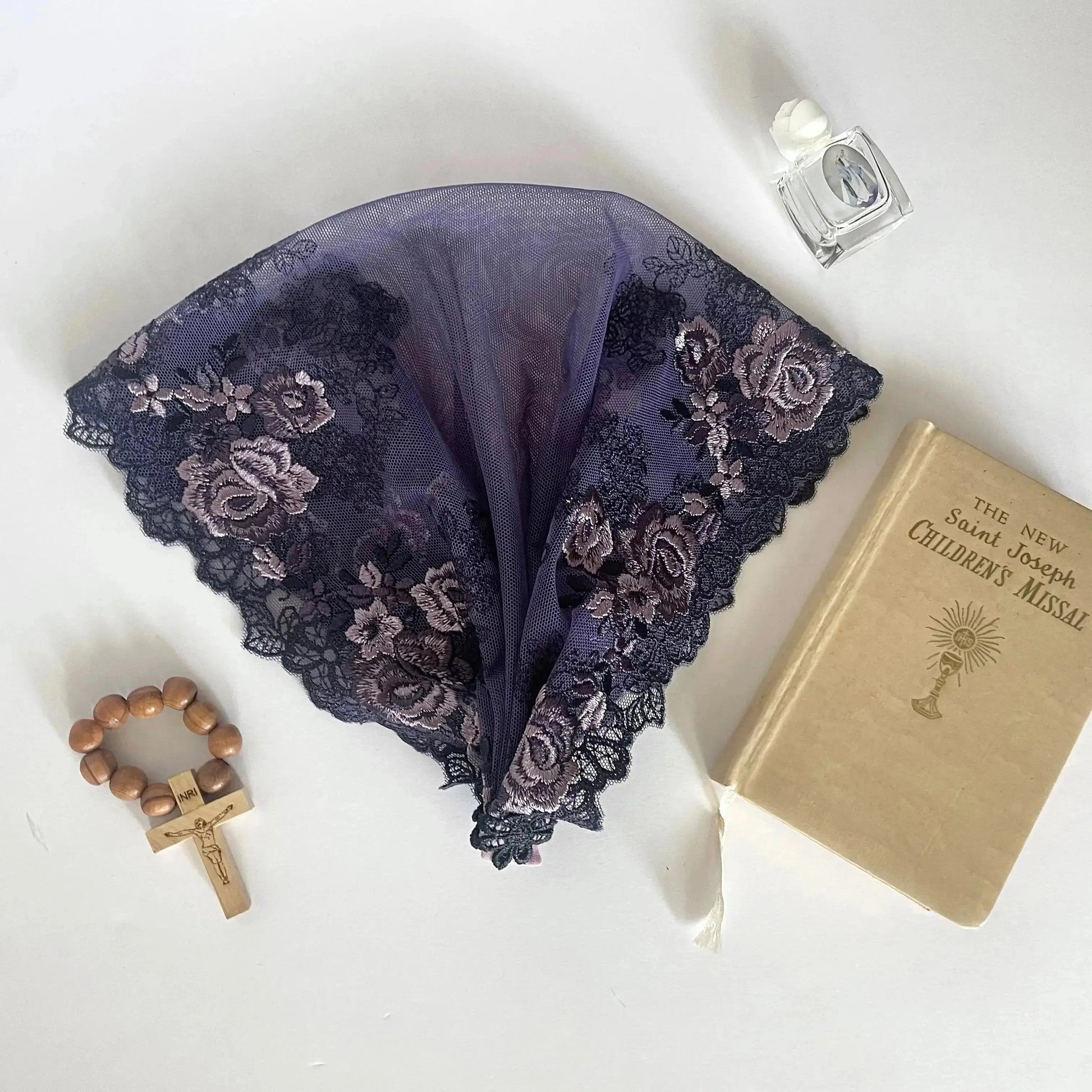 Dark purple lace veil with rose embroidery. The baby or toddler mantilla is perfect for Traditional Catholic Christian Mass