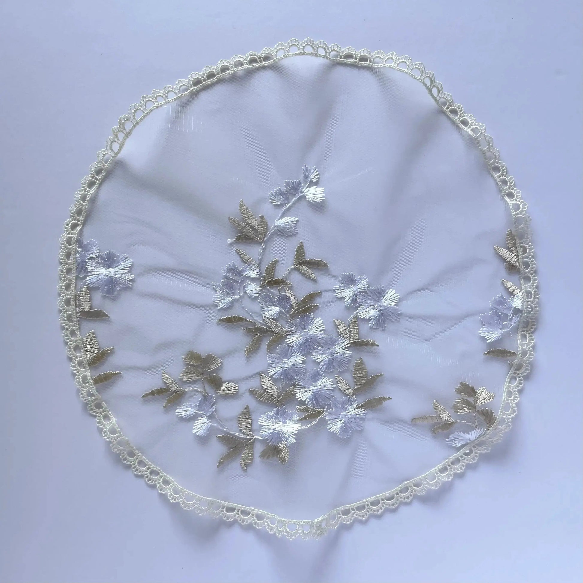 Floral embroidered white gold lace circular veil for girls at traditional Catholic mass or a prayer service.
