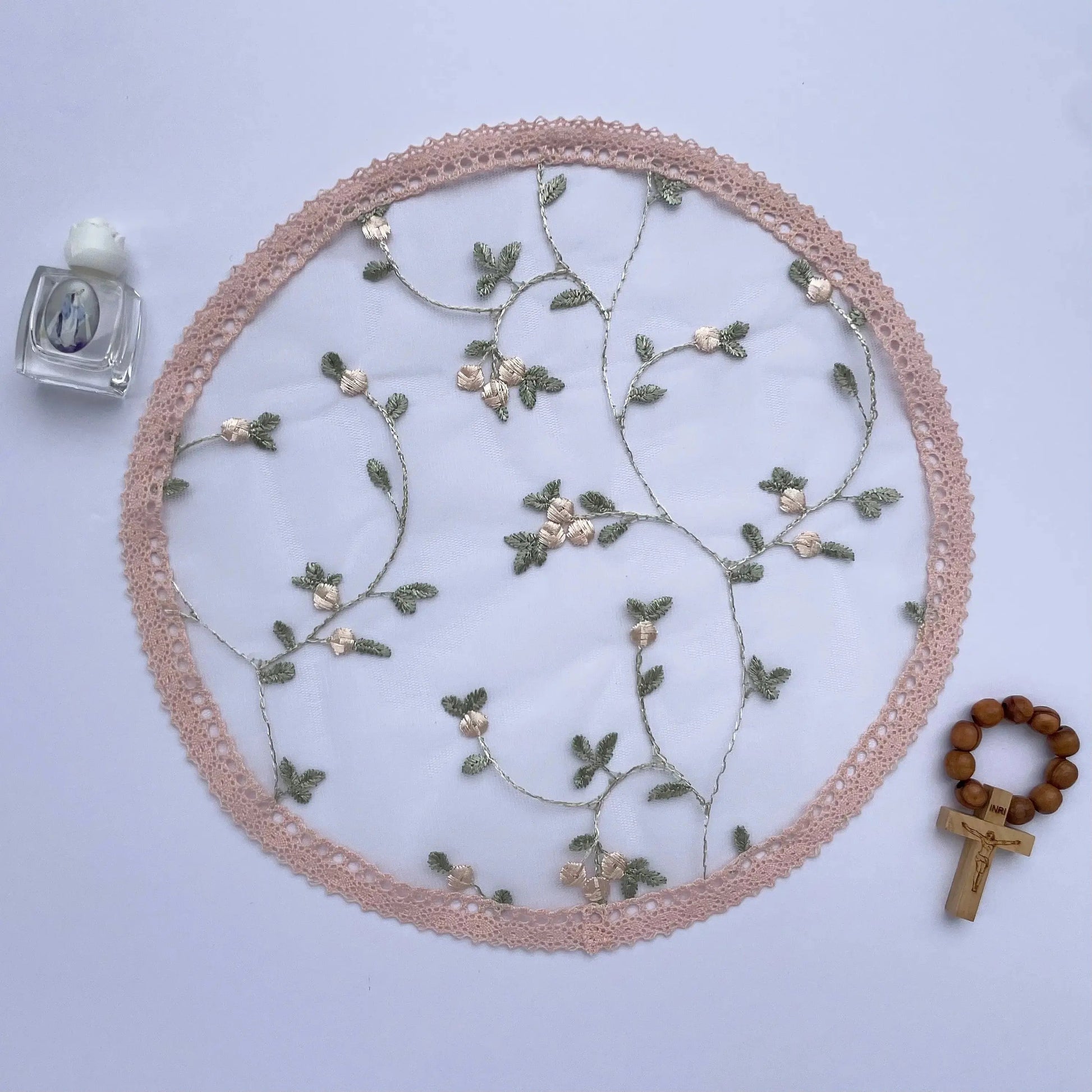 Pink floral lace circular cap veil, a traditional chapel veil for Catholic Mass.