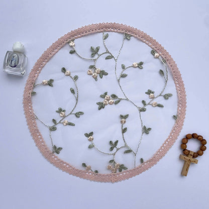 Pink floral lace circular cap veil, a traditional chapel veil for Catholic Mass.