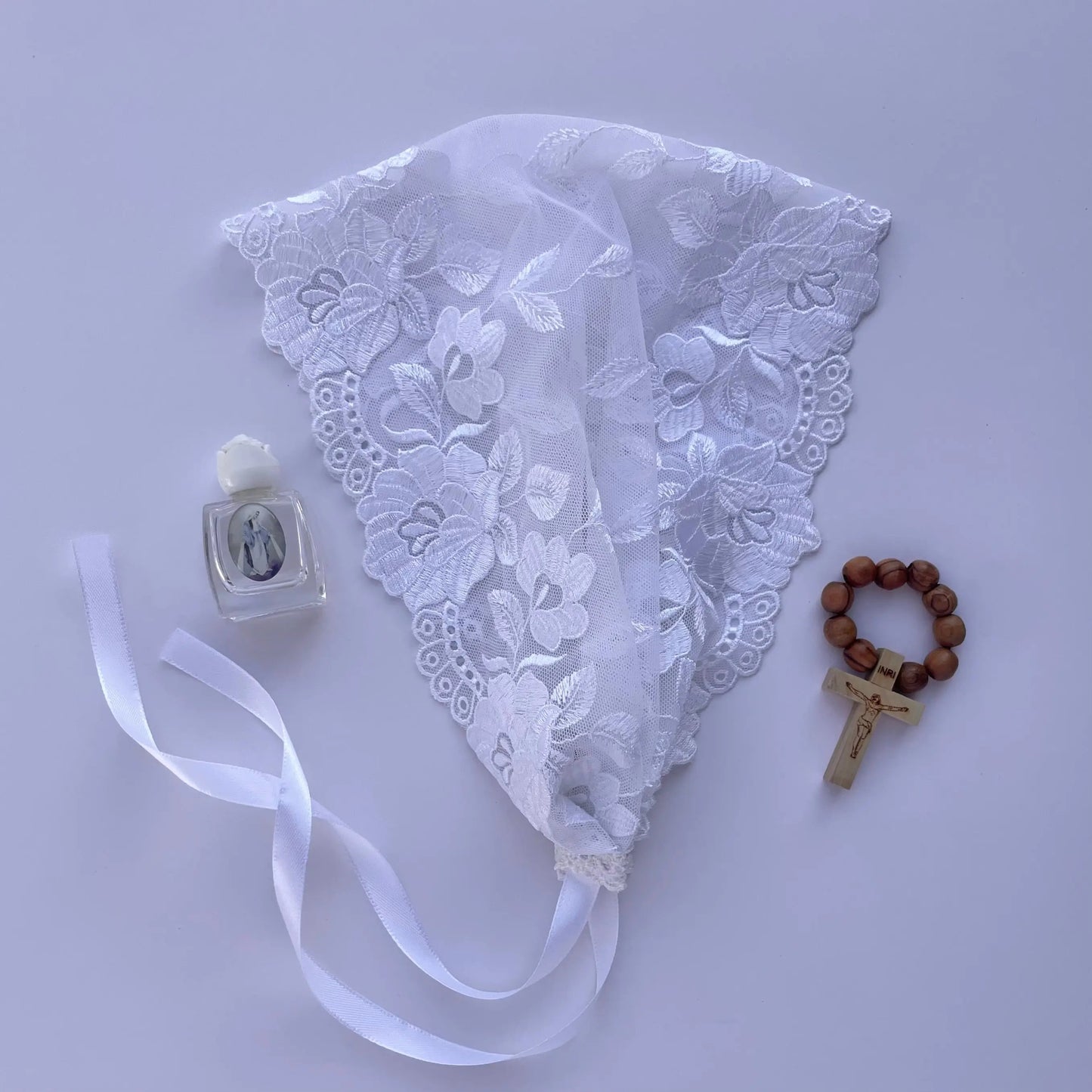 One size white lace bandana style chapel veil for a Catholic daily Mass or prayer service.